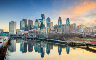 Managed IT Services in Philadelphia: A team of IT professionals working on computer systems and network servers in a modern office setting. Partnering with a reputable managed IT services provider can help businesses optimize their IT infrastructure and maximize productivity.